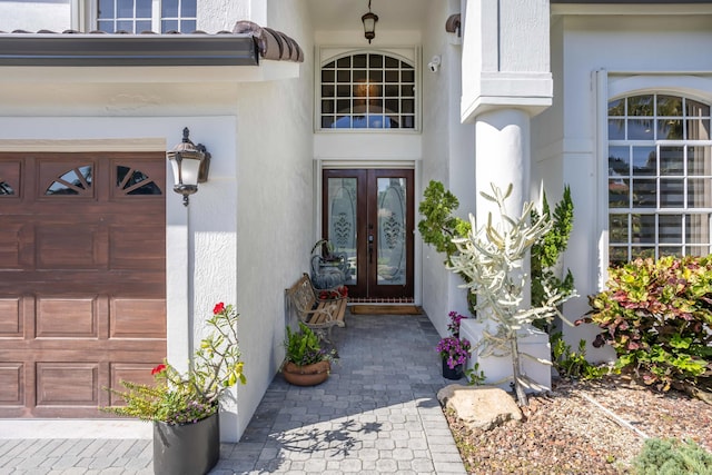 21741 Westmont Ct, Boca Raton, FL 33428 - property entrance with french doors and stucco siding