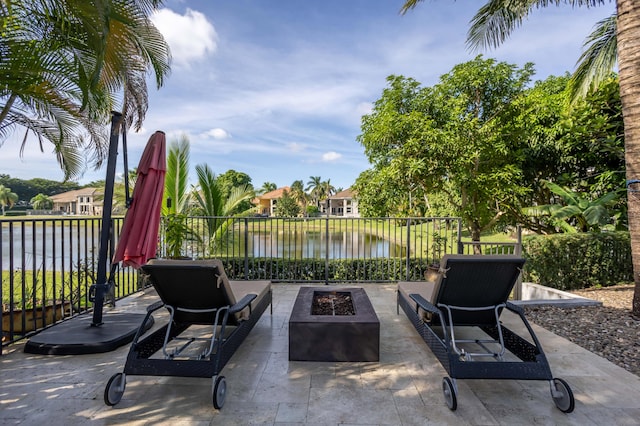 21741 Westmont Ct, Boca Raton, FL 33428 - view of patio with a fire pit and a water view