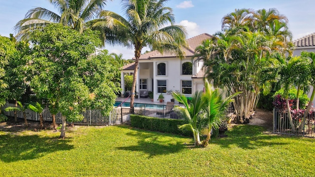 21741 Westmont Ct, Boca Raton, FL 33428 - rear view of property with stucco siding, a tiled roof, and a patio
