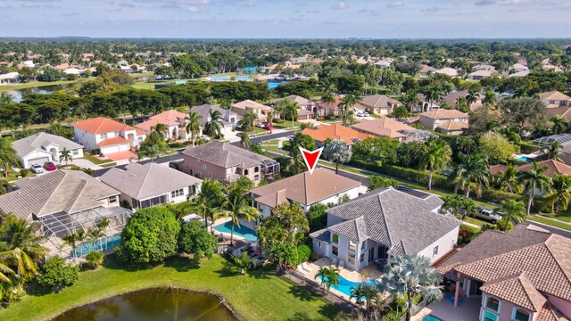 21741 Westmont Ct, Boca Raton, FL 33428 - aerial perspective of suburban area featuring a pool and a nearby body of water