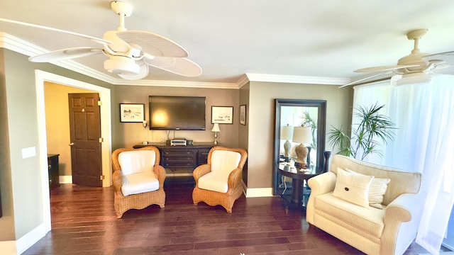 living area featuring crown molding, ceiling fan, baseboards, and wood finished floors