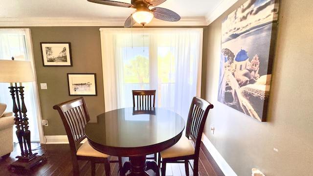 dining room with baseboards, ornamental molding, dark wood-style floors, and ceiling fan