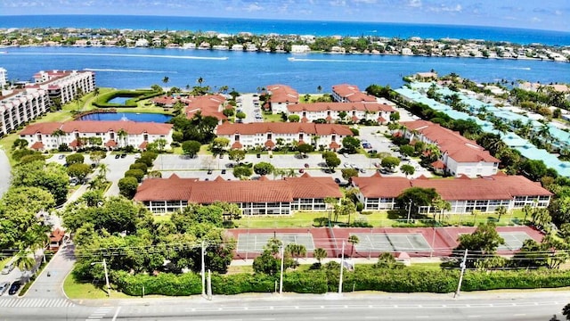 birds eye view of property featuring a water view and a residential view