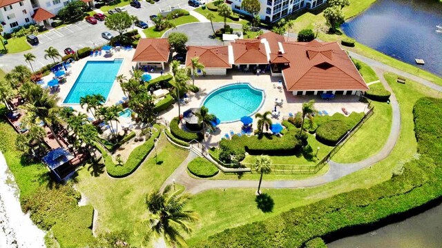 birds eye view of property with a water view