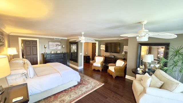 bedroom featuring baseboards, ceiling fan, ornamental molding, and wood finished floors