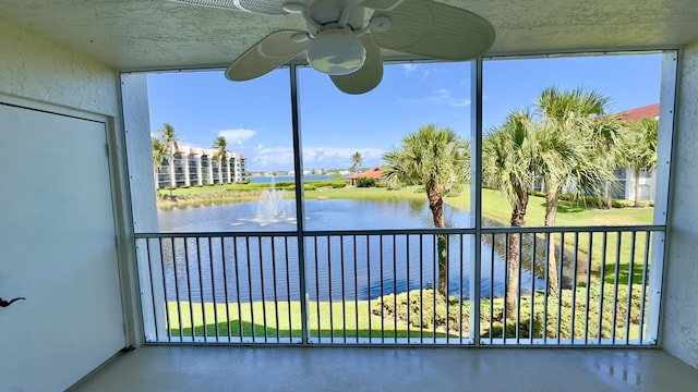 unfurnished sunroom with a water view