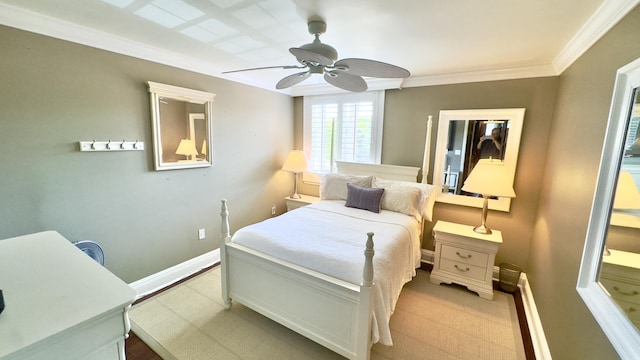bedroom featuring crown molding, baseboards, and a ceiling fan