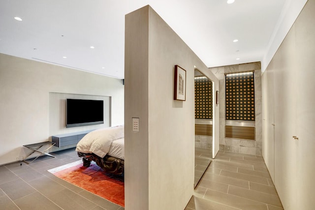 hall with tile patterned flooring and recessed lighting