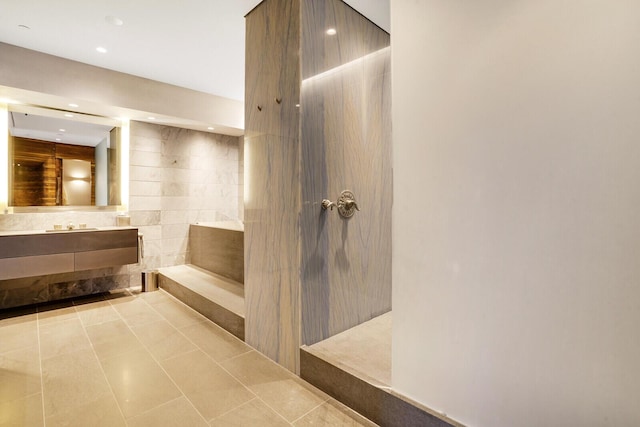 full bath featuring recessed lighting, tile patterned flooring, vanity, and walk in shower