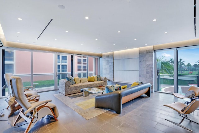 living area with expansive windows and recessed lighting