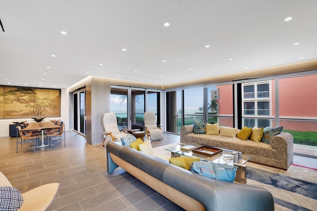 living area with expansive windows and recessed lighting