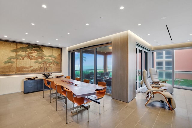 dining area with light tile patterned floors and recessed lighting