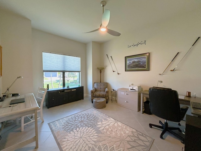 office area with light tile patterned floors and a ceiling fan