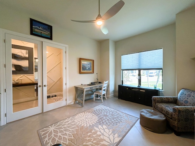 office space with french doors, ceiling fan, baseboards, and light tile patterned floors