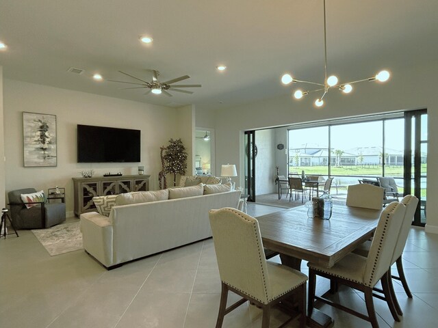 dining area with ceiling fan with notable chandelier, recessed lighting, visible vents, and light tile patterned floors