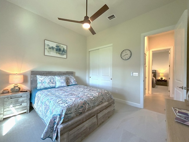 bedroom featuring visible vents, baseboards, ceiling fan, carpet, and a closet