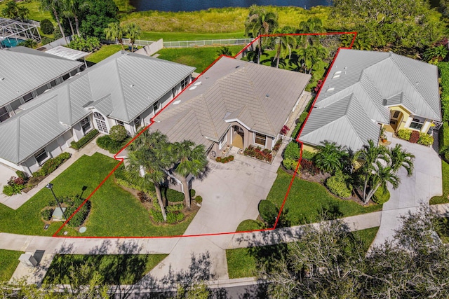 aerial view featuring a water view and a residential view