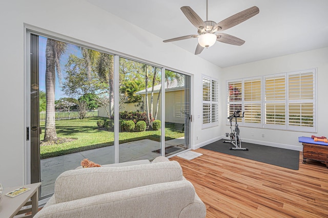 sunroom featuring a ceiling fan