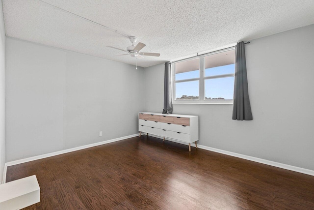5700 NW 2nd Ave Unit 401, Boca Raton, FL 33487 - unfurnished bedroom featuring a textured ceiling, wood finished floors, and baseboards
