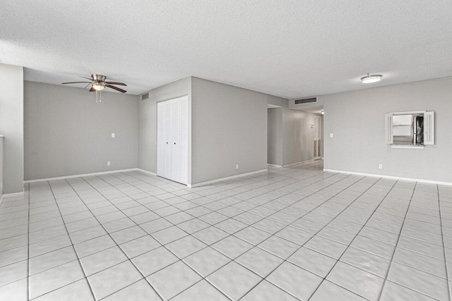 5700 NW 2nd Ave Unit 401, Boca Raton, FL 33487 - spare room featuring a textured ceiling, baseboards, visible vents, and a ceiling fan