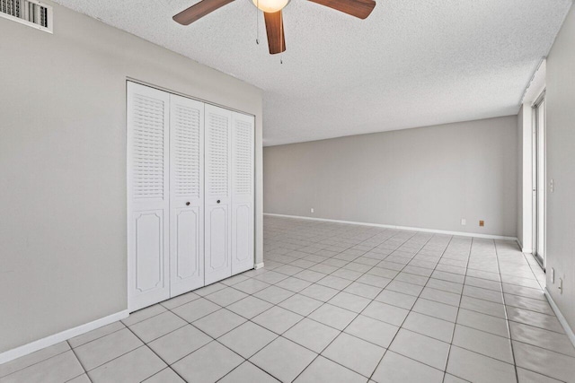 5700 NW 2nd Ave Unit 401, Boca Raton, FL 33487 - unfurnished bedroom featuring a closet, visible vents, ceiling fan, a textured ceiling, and baseboards