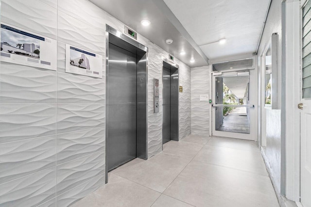 5700 NW 2nd Ave Unit 401, Boca Raton, FL 33487 - hallway featuring elevator