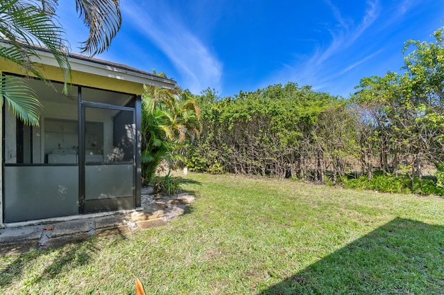 view of yard with a sunroom