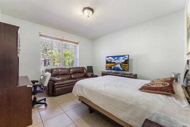 bedroom with light tile patterned flooring