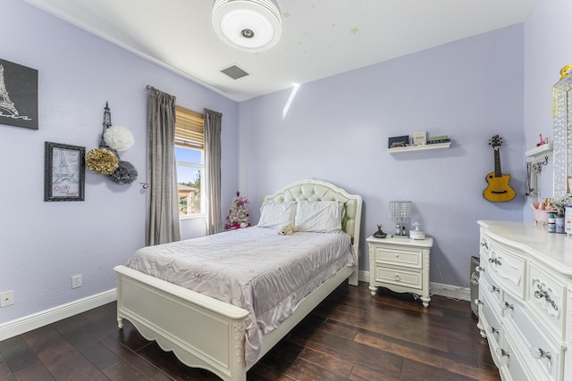 bedroom with dark wood finished floors, baseboards, and visible vents