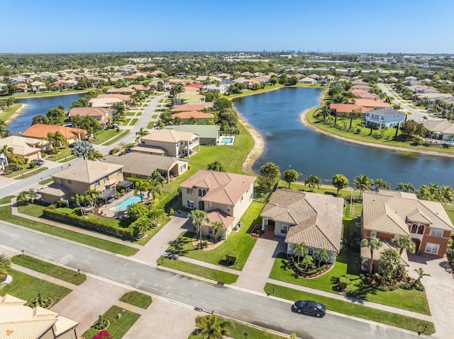 bird's eye view with a residential view and a water view