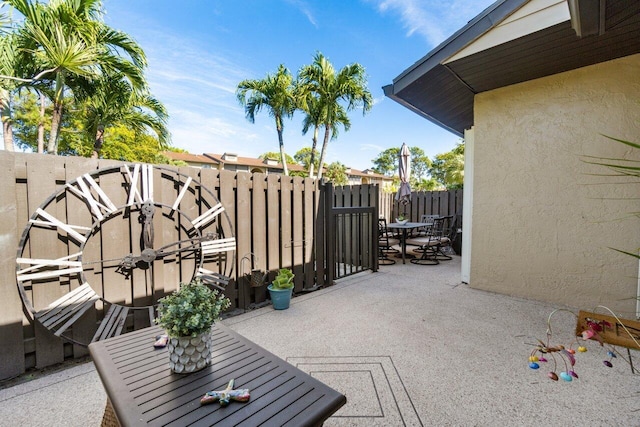 view of patio / terrace with outdoor dining area and fence