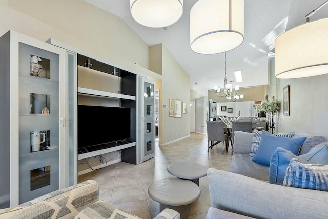 living area featuring baseboards, high vaulted ceiling, light tile patterned flooring, and an inviting chandelier