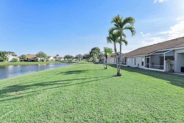 view of yard featuring a water view and a residential view