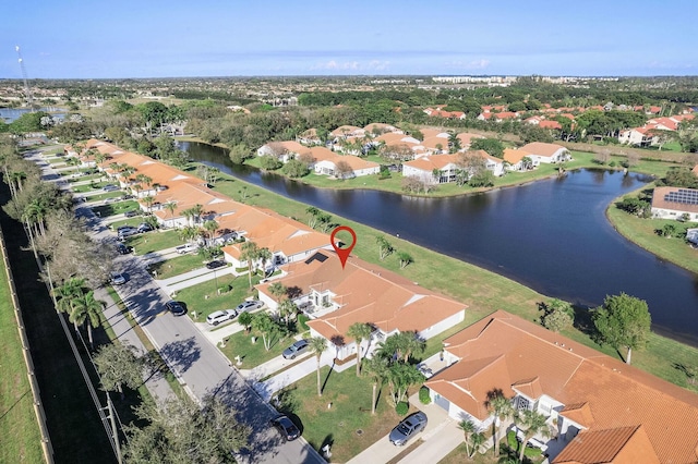 aerial view with a water view and a residential view