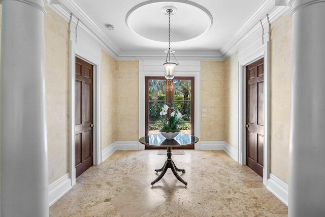 foyer featuring baseboards, ornamental molding, and french doors