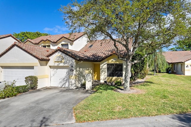 view of front facade with aphalt driveway, stucco siding, an attached garage, a front yard, and a tiled roof