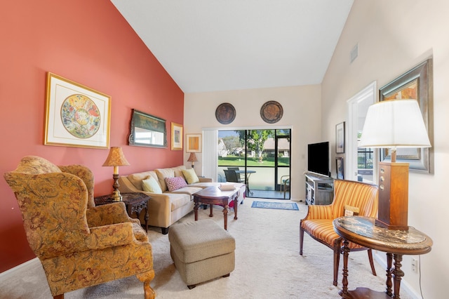 carpeted living room with high vaulted ceiling and visible vents