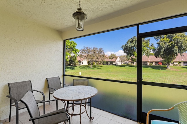 sunroom / solarium with a residential view