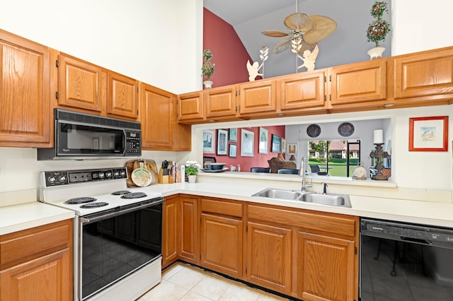 kitchen with high vaulted ceiling, light countertops, a sink, and black appliances