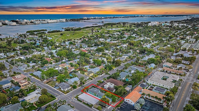 birds eye view of property featuring a water view