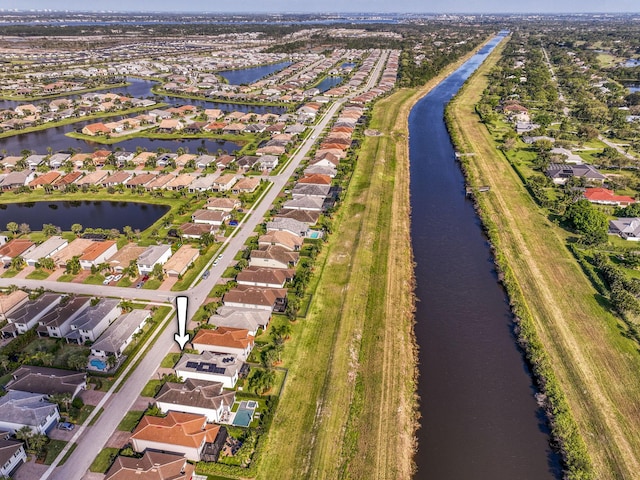 aerial view with a residential view and a water view