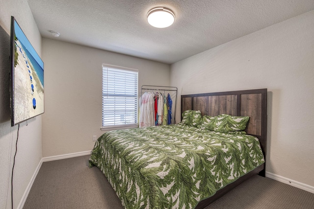 800 SE Villandry Way, Port Saint Lucie, FL 34984 - carpeted bedroom featuring a textured ceiling and baseboards