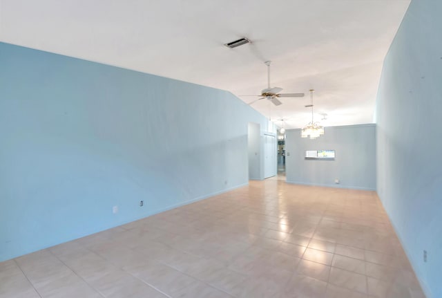 unfurnished room featuring ceiling fan with notable chandelier, vaulted ceiling, and visible vents