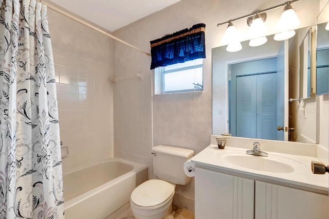 full bathroom with a closet, shower / tub combo with curtain, vanity, and toilet