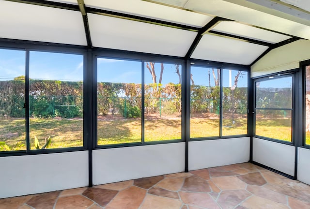 unfurnished sunroom with vaulted ceiling