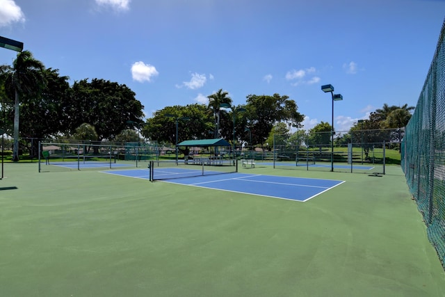 view of sport court featuring fence