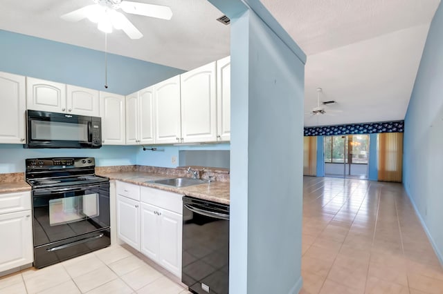 kitchen featuring a ceiling fan, white cabinets, a sink, and black appliances