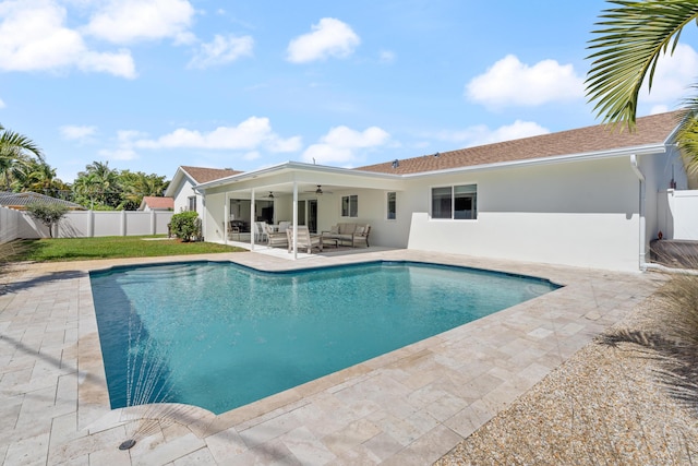 view of swimming pool with an outdoor hangout area, ceiling fan, a patio, and a fenced backyard