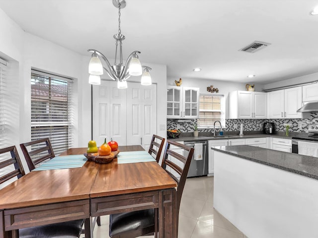 dining room with light tile patterned floors, recessed lighting, visible vents, and a notable chandelier