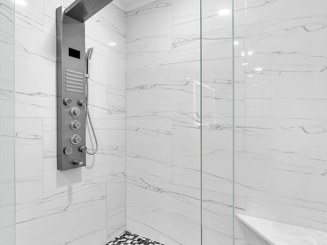 bathroom featuring a marble finish shower